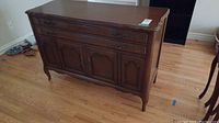 Full sideboard showing drawers, cupboard doors, and overall condition