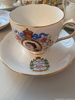 Close-up photo of Roslyn fine bone china teacup with commemorative Coronation of Queen Elizabeth II design on saucer