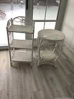 Photo showing both wicker pieces placed side by side on wood-look flooring by a window with snow outside.