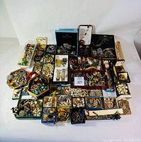 Overhead view of entire jewelry collection in assorted boxes and trays