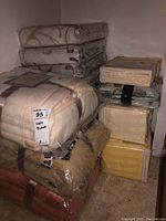 Overview of three fleece blankets stacked on left and four sheet sets on right