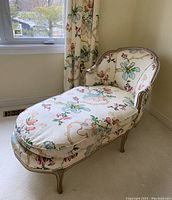 Front perspective of chaise lounge showing cushion and frame
