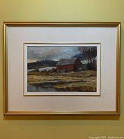Framed oil painting showing red barn landscape with signature visible.