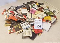 Pile of various vintage matchbooks with assorted covers in new and used condition
