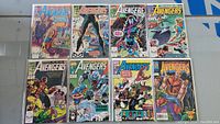 Full set of 8 vintage Avengers comic books laid out, showing cover art and condition.
