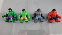 Photo showing four LEGO Hulk minifigures in different colors and shorts