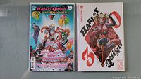 Two Harley Quinn comics, 25th and 30th Anniversary editions, displayed side by side.