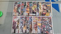 Overview of 19 Suicide Squad comic books issues #11-30 in protective sleeves.