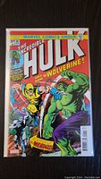 Front cover photo of The Incredible Hulk #181 comic book featuring Wolverine and Hulk in a fight scene. The comic is bagged and boarded.