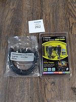 Photo of two new HDMI cables, one in sealed plastic packaging labeled 'High Speed HDMI Cable With Ethernet Length: 1.8m Color: Black QTY: 1PC' and one in retail blister pack from 'Xtreme' labeled '3' High Speed HDMI Cable Home Theater'.