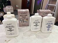 Two sets of Varathane Bar & Table Finish packaging and bottles for epoxy resin kits.