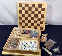Full set with wooden box open showing game pieces and cardboard external checkerboard chessboard lid propped up behind box
