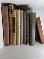 Full view of eight vintage hardcover books including 'Without Lawful Authority', 'Sandy', 'Book of Poems', 'Power', 'Death of a Nobody', and other titles.