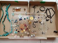 Top down photo of full collection showing turquoise bead necklaces, bracelets, pendants, earrings, and other jewelry.