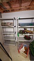 Two beige plastic shelving units side by side with items on shelves for context, located in basement.