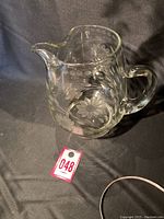 Clear glass pitcher etched with cornflower design, showing full pitcher profile.