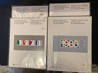 Four sealed souvenir collections of Canadian postage stamps from 1978, 1979, 1981, and 1983 placed side by side on a dark surface.
