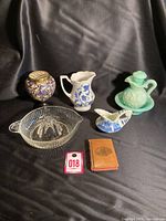 Full view of lot showing all six items on black fabric background