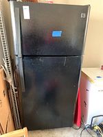 Front view of black top-freezer refrigerator