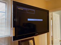 Front view of Samsung 32 inch TV turned off, showing screen with message 'Check signal cable'.