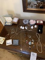 Overview of assorted jewelry on wooden table