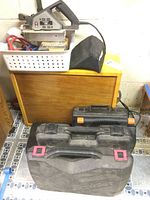 Overview of lot showing plastic basket, tool cases, wooden case, dust collector and cords