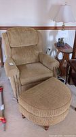 Recliner with matching ottoman showing full frontal view and fabric texture.