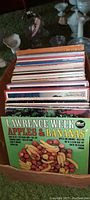 Box of vintage LP records featuring 'Lawrence Welk Apples & Bananas' at the front, part of a large private collection.