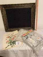 Bulletin board, book, and wrapped paper together showing scale and condition