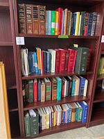 Bookshelves with a variety of legal and academic books, mostly hardcover, with some paperbacks, arranged by size and topic.