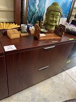 Photo showing the whole filing cabinet with some decorative items on top