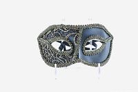Front view of a black matte Venetian masquerade mask with gold lace overlay, showing detailed lace pattern around the eye area and shaped form.