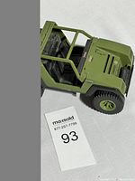 Olive green GI Joe V.A.M.P. toy jeep vehicle shown from front angle with black interior.
