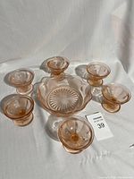 Full set of six custard cups and one serving bowl in pink peach Depression glass