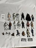 Full layout photo showing all 23 figures and Star Wars display bases