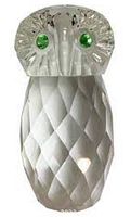 Close-up front view of the clear faceted crystal owl figurine with green crystal eyes.
