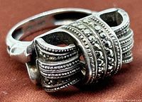Close-up view of the sterling silver ring showing marcasite stone detailing and intricate beadwork on top