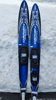 Front view of both skis on snow showing overall design and condition