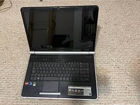 Front view of Gateway laptop computer showing keyboard, touchpad, and screen (powered off).