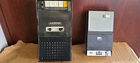 Two vintage cassette recorder players placed side by side on a surface, showing overall condition and design