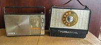 Two vintage transistor radios placed side by side showing front faces including dials and speakers.