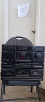 Front view of the stacked Pioneer stereo system components showing the tuner, cassette deck, and amplifier sections.