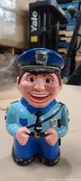 Full front view of the Cookie Cop cookie jar displaying the face, uniform, and cop hat with badge.