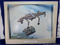 Full view of aviation art print showing reaction drive heavy lift helicopter lifting army vehicle with matting visible