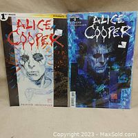 Two Alice Cooper comic books, issues 1 and 3, displayed upright with bags and boards. Covers are clear and colorful with distinct Alice Cooper artwork.