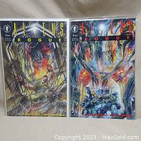 Front view of Aliens Rogue Issues 1 and 2 comic books side by side, bagged and boarded.