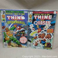 Two Marvel Two-in-One comic books side by side, issue #45 and #53, both bagged and boarded showing cover art and condition.