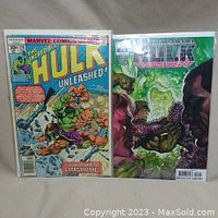 Photo showing front covers of The Incredible Hulk #216 and Immortal Hulk comic books placed side by side.