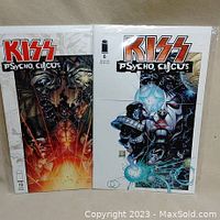 Front view of Kiss Psycho Circus comic issues #6 and #19 in protective bags.