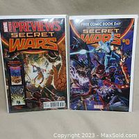 Two Marvel Secret Wars comic books displayed side by side, Previews issue and Secret Wars #0 issue.